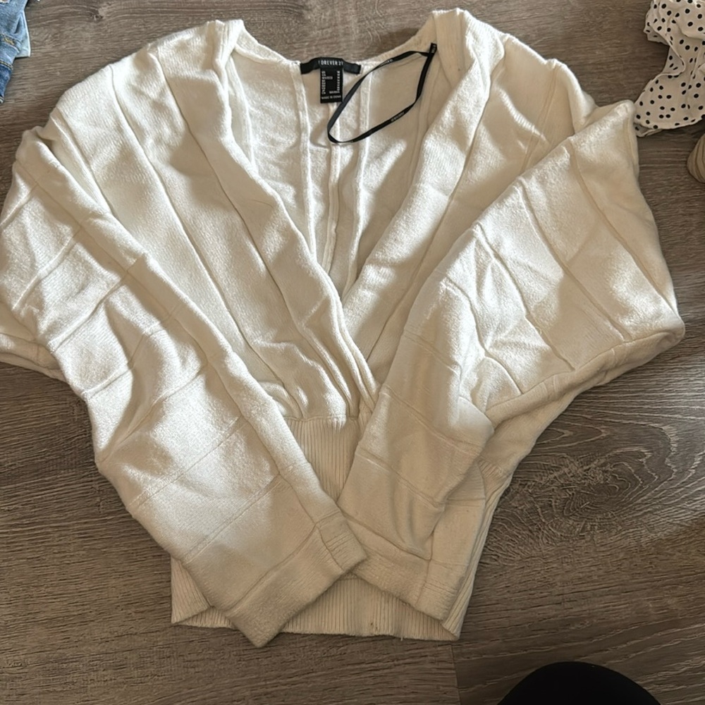 Cropped v neck sweater.